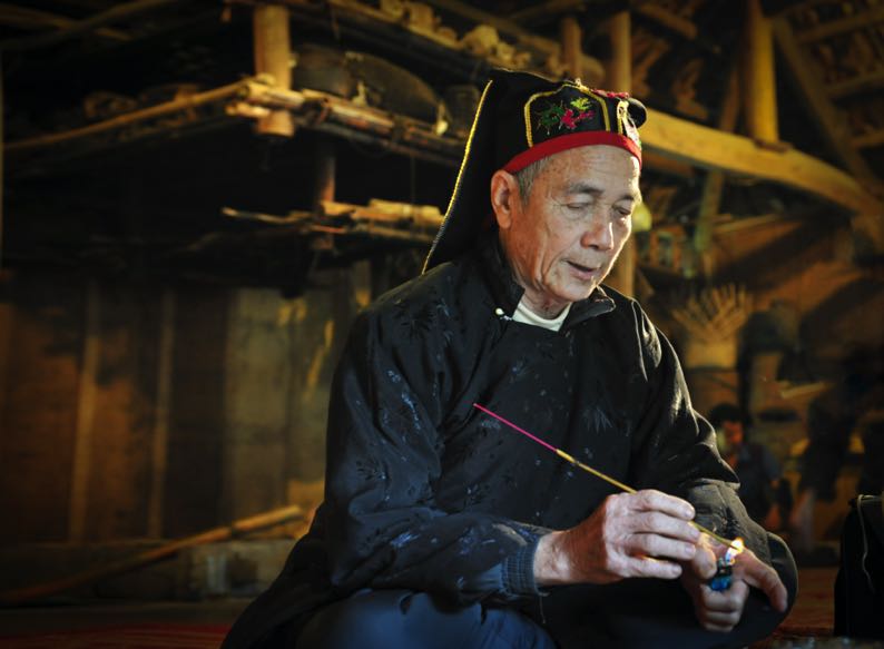Mo shamans preserve ancient oral verses containing stories, beliefs, and community history 