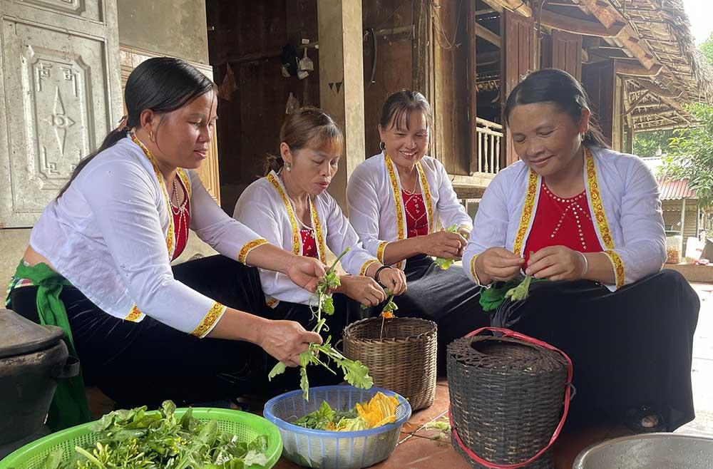 Family members gather outside to prepare fresh ingredients for the evening festival