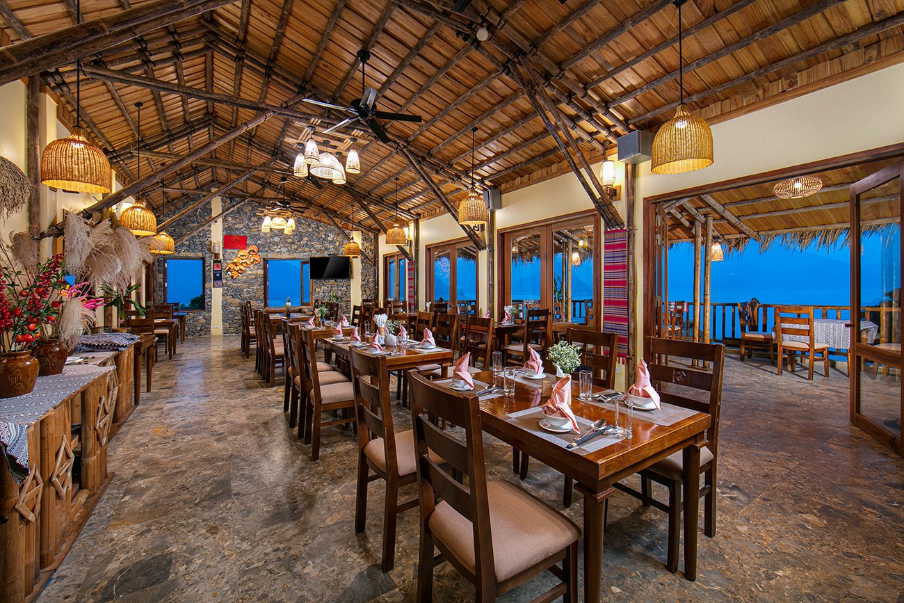 Bamboo Restaurant reception with a twisted bamboo staircase at Mai Chau Hideaway