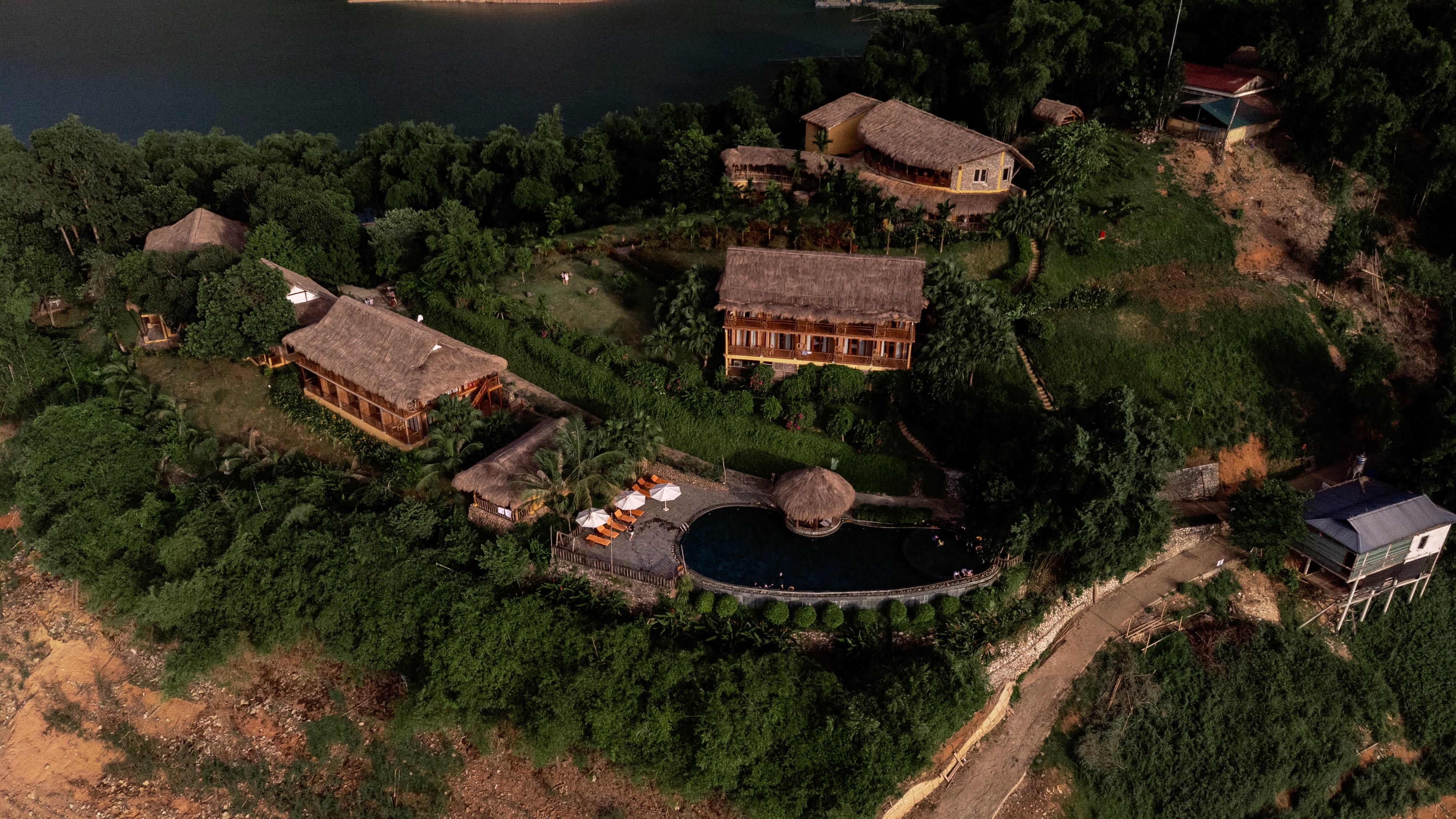 Aerial or waterline shot of Mai Chau Hideaway's peninsula setting