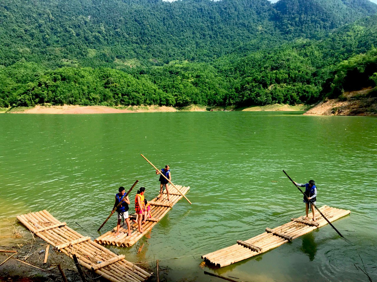 Bamboo rafting on the tranquil lake